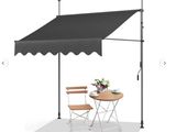 an image of a table and chairs under a black awning
