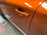 a close up of a car door handle on the side of the car