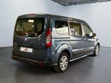 a grey van that is parked inside of a building
