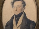 portrait of a man in a suit and tie in a picture frame