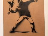 painting of a man throwing a bird on a cardboard box