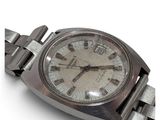 a silver wrist watch with roman numerals on it