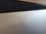 a close up of a laptop on a wooden table