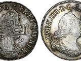 a silver coin with an image of a man on it