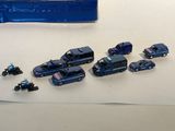 a lot of toy cars that are sitting on a table