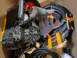 a cardboard box filled with assorted electronics and wires