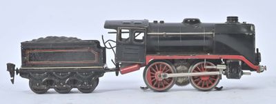 un petit train posé sur une surface blanche