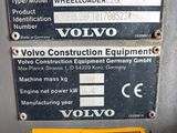 a sign that says volvo construction equipment on the side of a machine