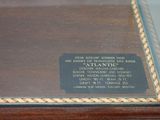 a plaque on top of a wooden table that says atlantic