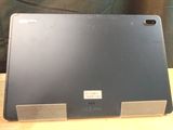 a laptop that is sitting on a wooden table