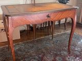 a wooden table with a drawer on top of it