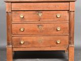 an old wooden chest of drawers with brass handles