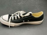 a close up of a pair of black and white sneakers