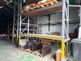 a room with a lot of shelves and pallets in it
