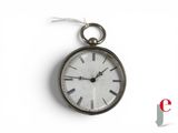 a silver clock hanging from a chain on a white background