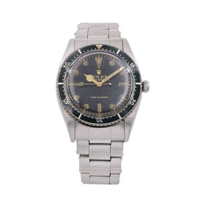 a close up of a wrist watch on a white background