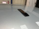 a remote control sitting on top of a glass table