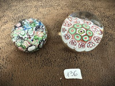two stones sitting on a table with a price tag on it