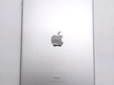 an apple ipad sitting on top of a white table next to a white wall