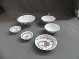 a group of bowls and bowls sitting on a table