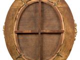 an image of a round wooden window with a cross on it