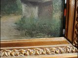 a picture of a painting of a stonehench in a gold frame