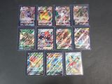 beaucoup de cartes pokemon différentes sur la table