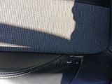 a close up of a seat in a car with a bag on it