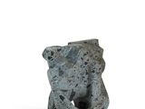 a small statue of a bear that is sitting on a table