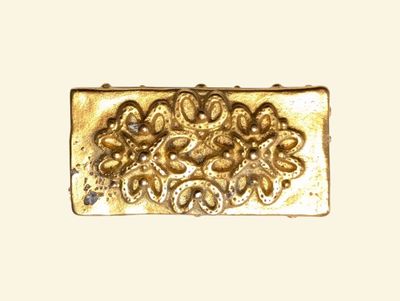 an image of a gold plate with flowers on it