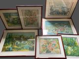 several framed pictures of flowers and trees are displayed in a display case