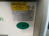an image of a machine with a warrant sticker on it
