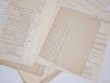 several papers are stacked on top of each other on a table