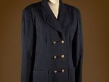 an image of a black coat on a mannequin stand