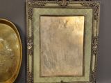 a picture of a mirror, a bowl, and a plate on a table