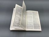 an open book that is sitting on a table