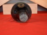 a bottle of wine that is sitting on a table