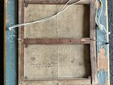 an old wooden picture frame with a chalkboard and a string attached to it