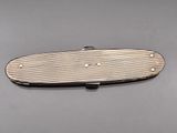 an image of a silver plated pocket knife on a gray surface