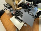 a desk with a lot of electronics on top of it