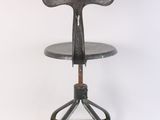 an image of a metal stool with a wooden seat on a white background