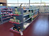 many shelves in the store that have various items on them