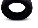 a tire that is sitting on a white surface