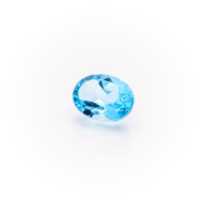 a blue topaze gems on a white background