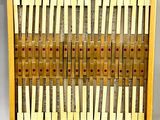 a close up of a wooden display case filled with lots of notes