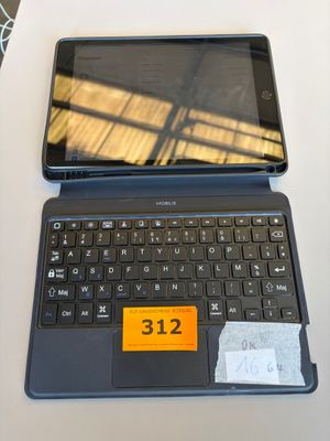 a laptop and a tablet on a table with a price tag on it