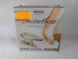 the box is open to show the contents of a smoothee device