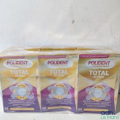 three boxes of toothpaste sitting on top of a counter