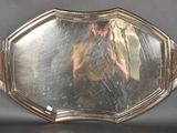 a silver tray with a mirror on it