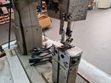 an image of a sewing machine in a factory